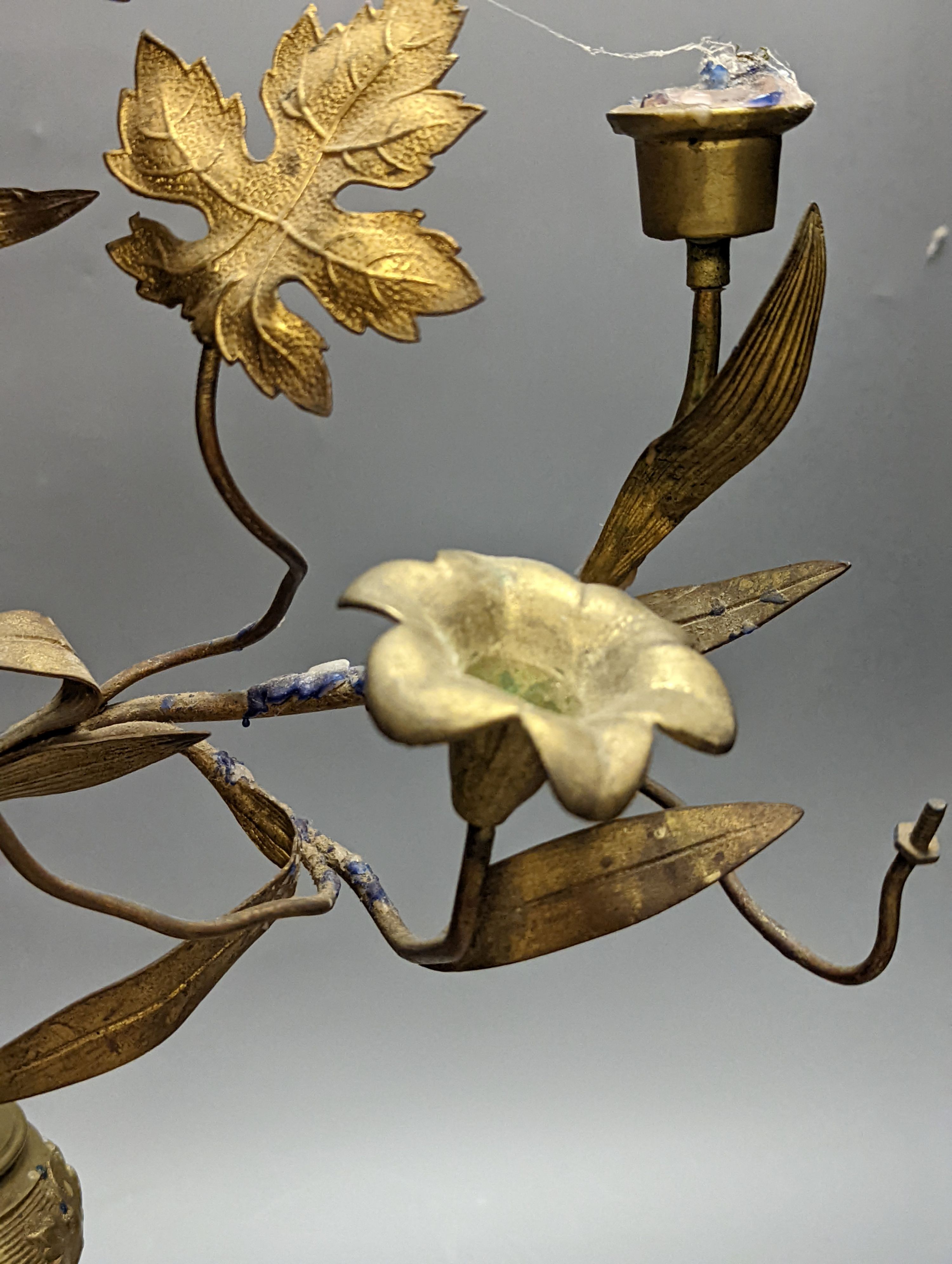 A Victorian cast gilt metal candelabrum, mounted with glass flower heads